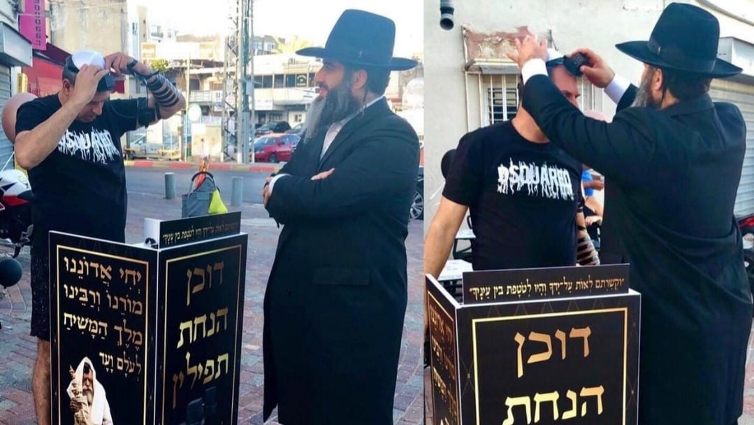 הרב רונן שאולוב&nbsp;במרכז. צילום: פרטי