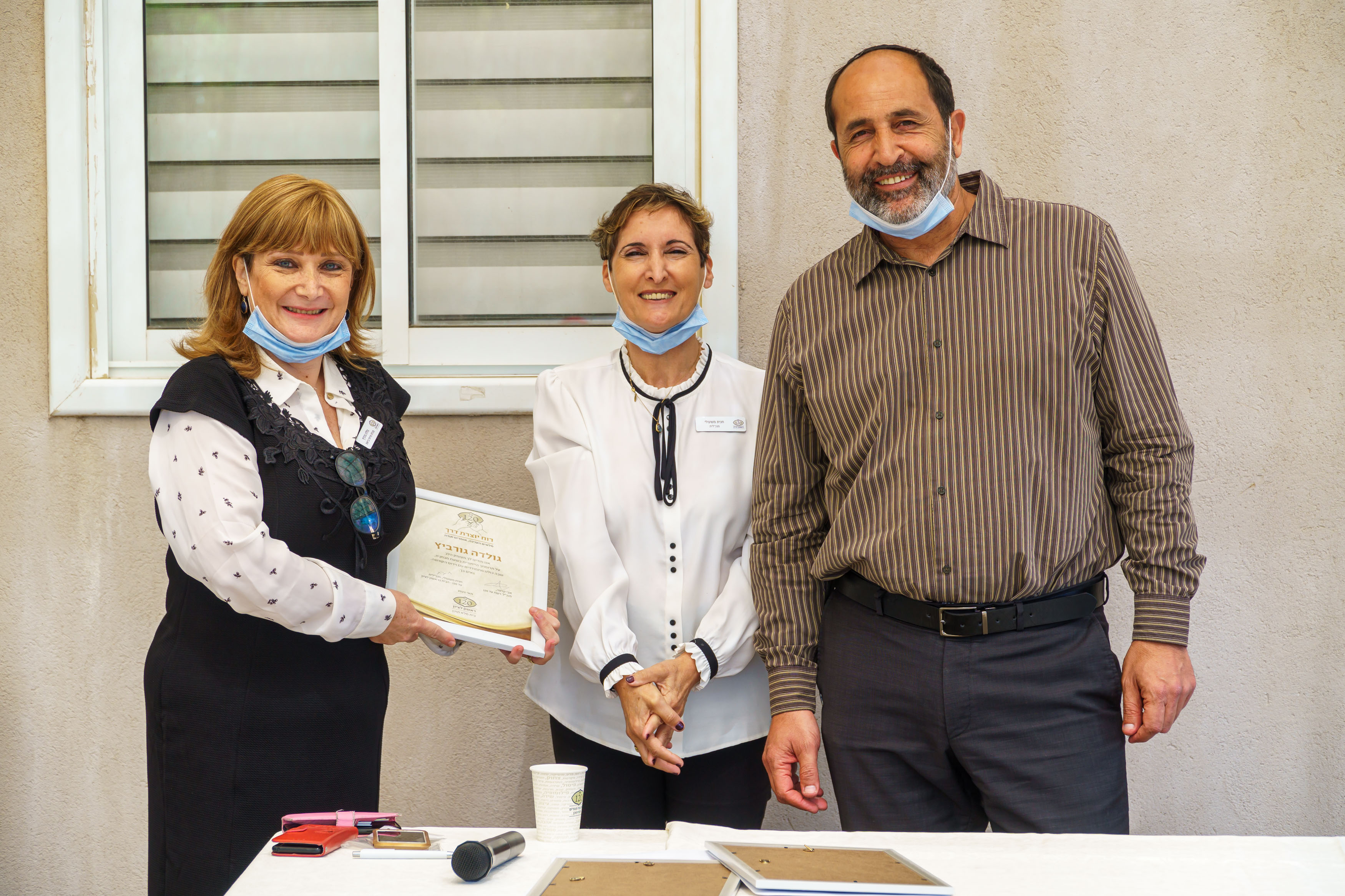 אבי קלפה וחגית משעולי בטקס ההוקרה לעובדים <br> צילום: שי אפגין