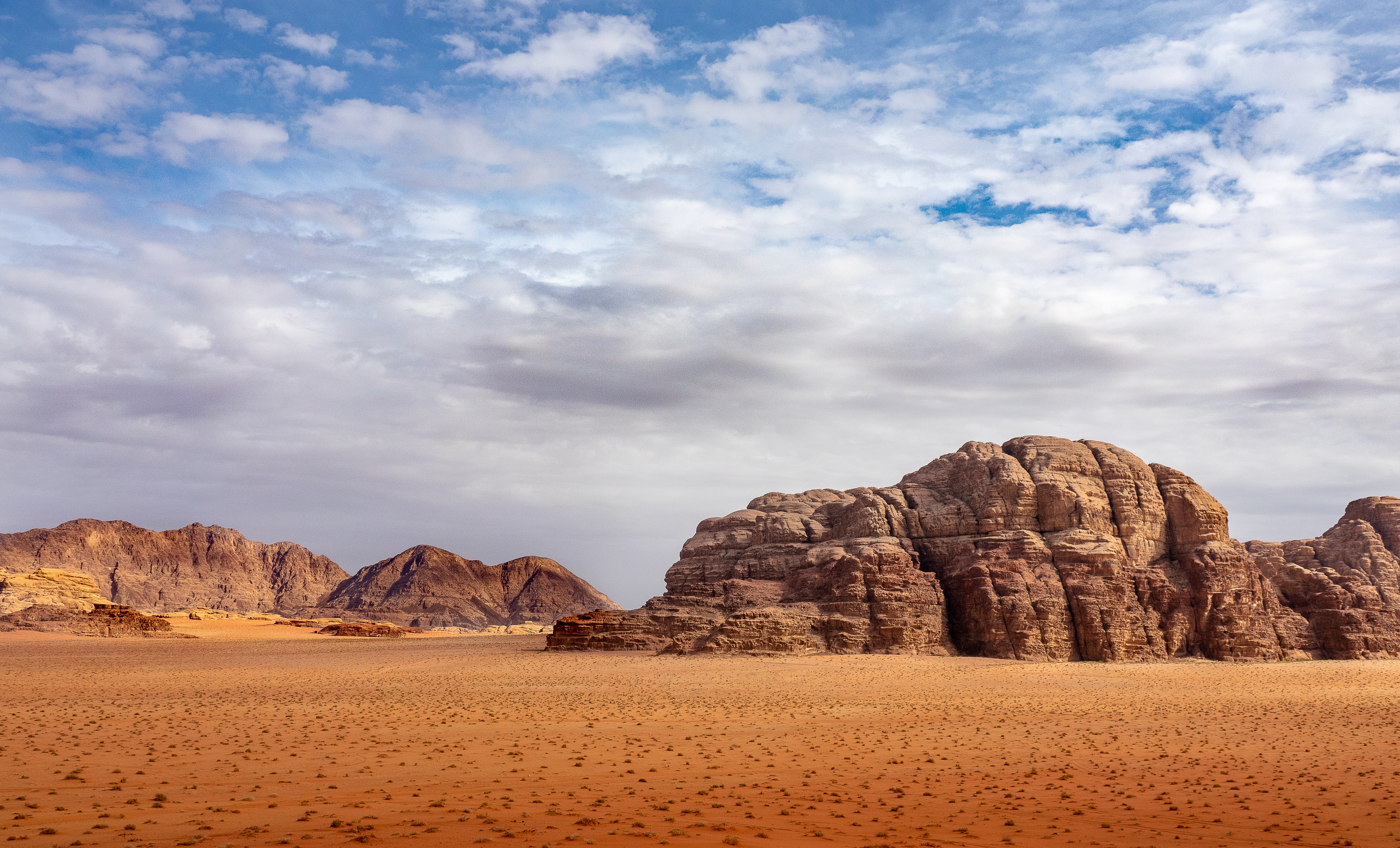 <a href="https://www.freepik.com/free-photo/cliffs-caves-desert-full-dry-grass-cloudy-sky-during-daytime_12449285.htm#query=desert&position=4&from_view=search&track=sph">Image by wirestock</a> on Freepik